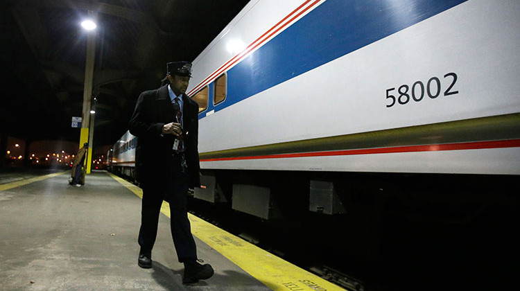 In this Dec. 16, 2014 photo Conductor Robert Smith does a visual inspection of the Amtrak train before it leaves Union Station in Indianapolis.  - AP Photo/Darron Cummings