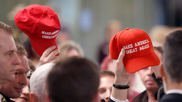 Members in the audience hold up "Make America Great Again" hats at the conclusion of a speech by Vice President Mike Pence at the America First Policies, "Tax Cuts to Put America First" event Thursday, March 22, 2018, in Manchester, N.H.  - AP Photo/Mary Schwalm