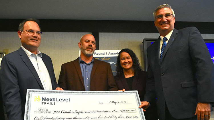 Gov. Eric Holcomb presented a check to the 933 Corridor Improvement Association as part of the Next Level Trails initiative.  - Justin Hick/IPB News