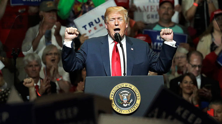 President Donald Trump addresses the crowd during a Republican campaign rally Thursday, May 10, 2018, in Elkhart. - AP Photo/Charles Rex Arbogast