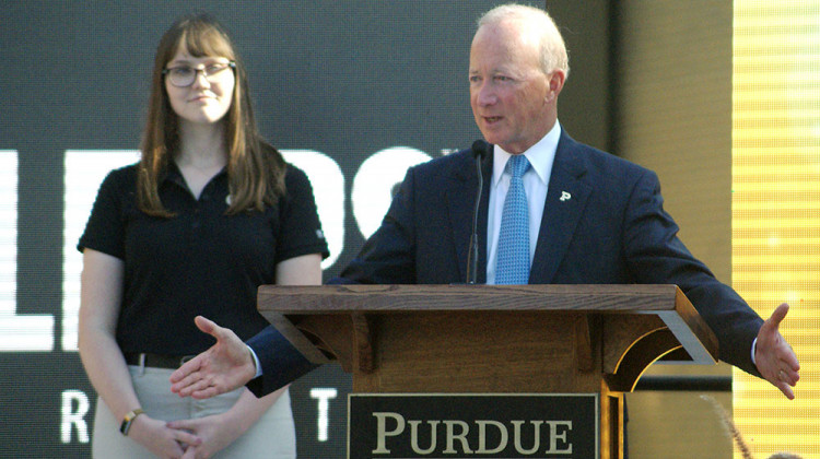 Purdue President Mitch Daniels, with senior Michaela Rumple standing to his left, tells attendees what the new Engineering and Polytechnic Gateway Complex will mean for students and businesses. - Samantha Horton/IPB News