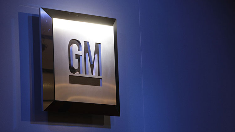 FILE - In this Jan. 12, 2009 file photo, the General Motors logo is seen on display at the North American International Auto Show in Detroit. GM is s recalling more than 240,000 vehicles to fix a problem that could hamper rear brake performance. - AP Photo/Paul Sancya, File