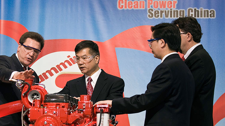 FILE PHOTO: In this 2009 photo, then U.S. Secretary of Commerce Gary Locke, center, looks at a diesel engine made by Cummins Inc. at a plant in China. The Columbus, Indiana-based engine maker has been subject to Chinese and U.S. tariffs during the economic dispute between the two counties. - AP Photo/Andy Wong, file
