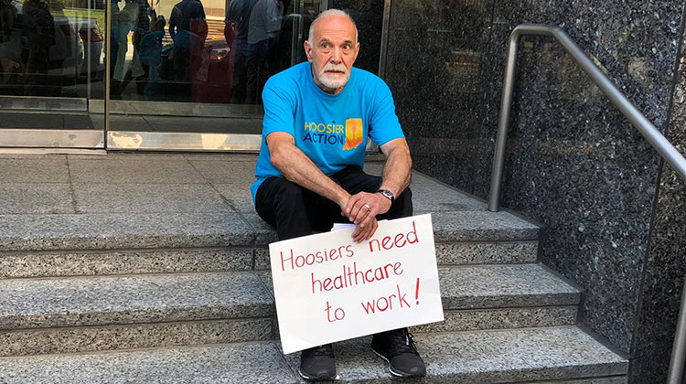On July 1, protesters gathered in downtown Indianapolis to protest the rollout of Gateway to Work. Protesters delivered thousands of letters to Gov. Eric Holcomb asking him to halt the roll out of the work requirement. - Carter Barrett/Side Effects Public Media