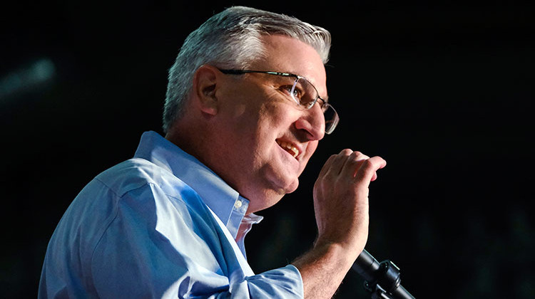 FILE - In this July 13, 2019 file photo, Indiana Gov. Eric Holcomb speaks at a campaign rally in Knightstown, Ind. Holcomb is facing calls from Democrats to explain his role in Amazon being cleared in a worker's death despite initial findings of major safety violations. The Republican Gov. denies any involvement in the state Department of Labor's investigation. - AP Photo/AJ Mast, File