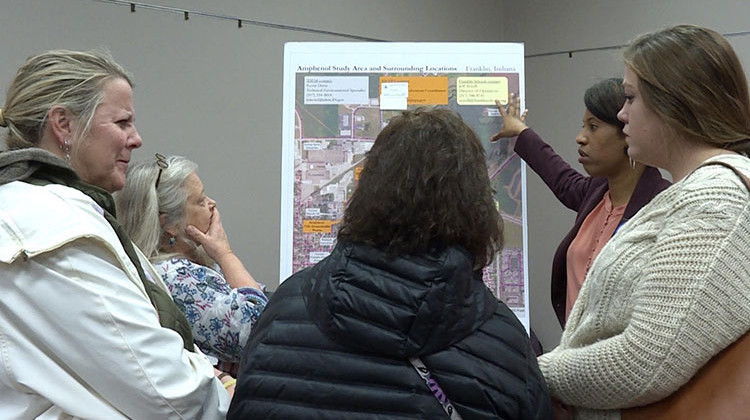 Franklin residents talk with officials at the Environmental Protection Agency about the contamination at an open house on Dec. 3. - Rebecca Thiele/IPB News