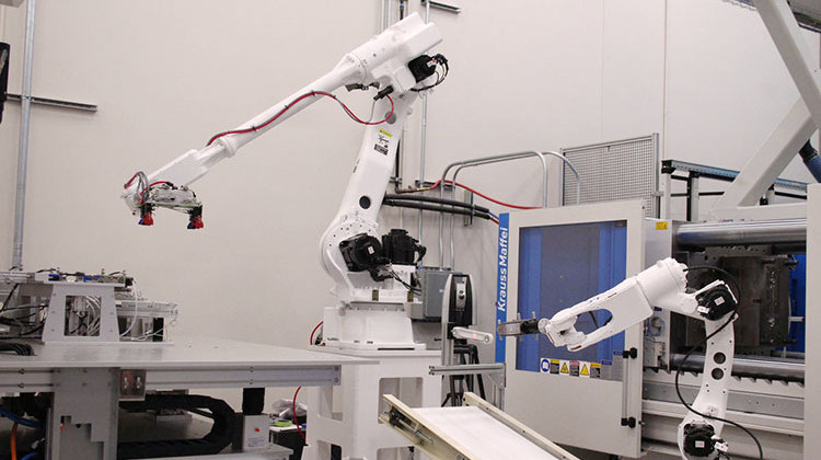 Inside Purdue University's new Manufacturing Design Laboratory, robots fabricate pieces, then hand them off to one another for testing – all without humans touching the parts. - Samantha Horton/IPB News