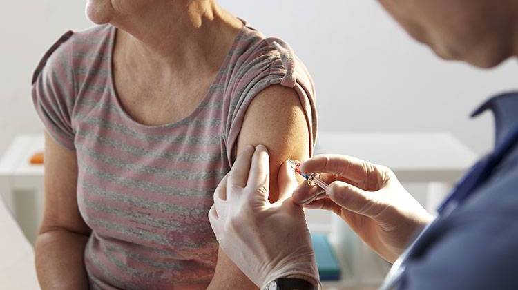 The Centers for Disease Control and Prevention recommends the flu vaccine for everyone six months of age and older. - stock photo
