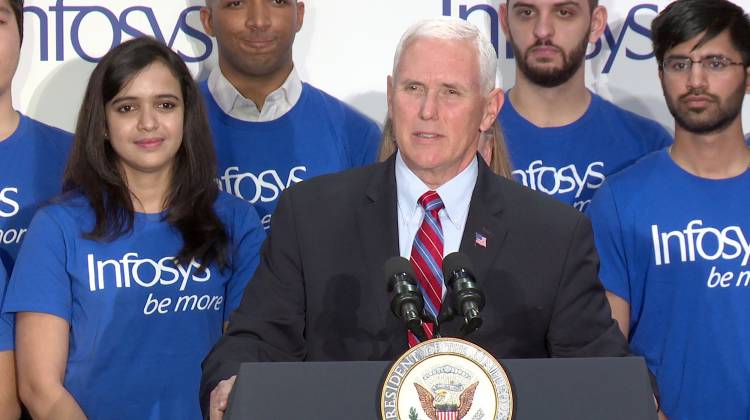 Vice President Mike Pence applauds global tech firm Infosys’s plans to create thousands of jobs in Indiana.  - Lauren Chapman/IPB News