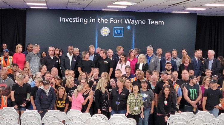 Staff and officials celebrate General Motors announcement of $632 million investment in the Fort Wayne Assembly plant. - Tony Sandleben/WBOI