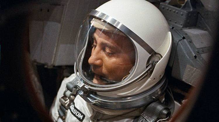 Astronaut Virgil I. Grissom is seen through the spacecraft window prior to launch of Gemini-Titan 3 mission. - NASA