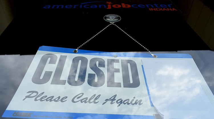 A WorkOne center in Knox, Indiana, displays a closed sign on the front door.  - Justin Hicks/IPB News
