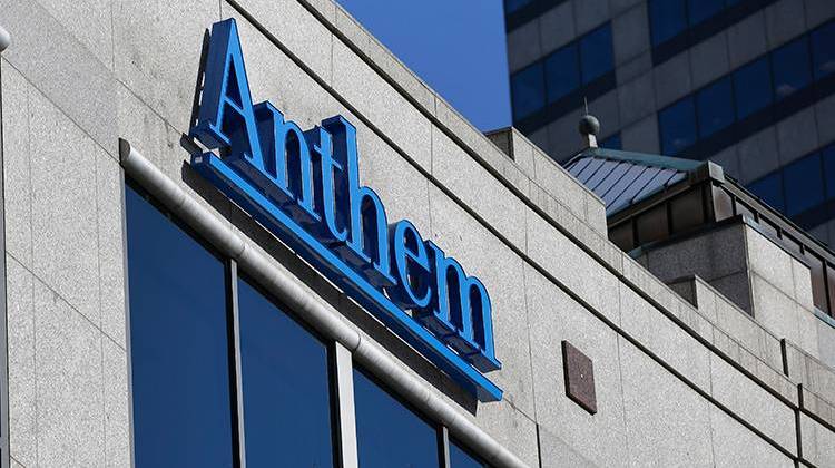 FILE - In this Thursday, Feb. 5, 2015, file photo, the Anthem logo hangs at the health insurer's corporate headquarters in Indianapolis. Anthem beat Wall Street expectations, Wednesday, Oct. 31, 2018, and hiked its 2018 forecast again as the Blue Cross-Blue Shield insurer added more Medicare customers and continued to clamp down its biggest expense, benefit payouts, in the third quarter. - AP Photo/Michael Conroy, File