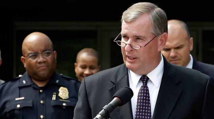Indianapolis Mayor Greg Ballard, right, and Metropolitan Police Department Chief of Police Rick Hite, left, announce in Indianapolis, Monday, July 8, 2013, a plan to put more uniformed police officers on the streets of Indiana's capital following a spate of deadly shootings - AP Photo/Michael Conroy
