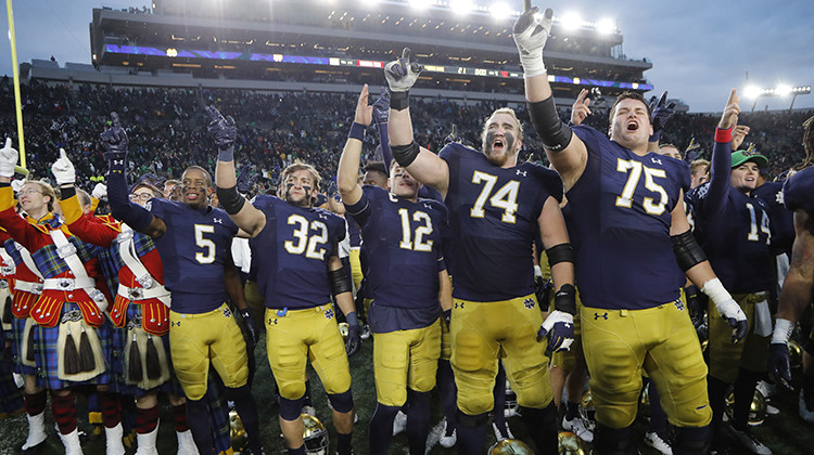 Members of the Notre Dame football team sing at the end of an NCAA college football game against Virginia Tech, Saturday, Nov. 2, 2019, in South Bend, Ind. Notre Dame won 21-20. - AP Photo/Carlos Osorio