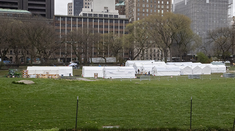 Medical personnel work on preparing to open a 68 bed emergency field hospital specially equipped with a respiratory unit in New York's Central Park, Tuesday, March 31, 2020, in New York. - AP Photo/Mary Altaffer