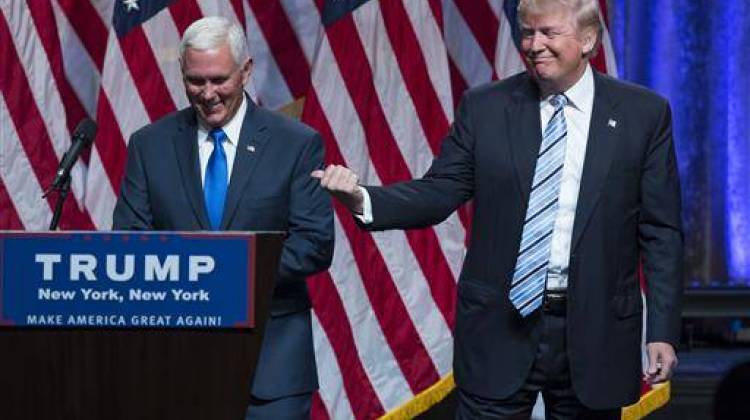 Republican presidential candidate Donald Trump, right, introduces Gov. Mike Pence, R-Ind., during a campaign event to announce Pence as the vice presidential running mate on, Saturday, July 16, 2016.  - AP Photo/Evan Vucci