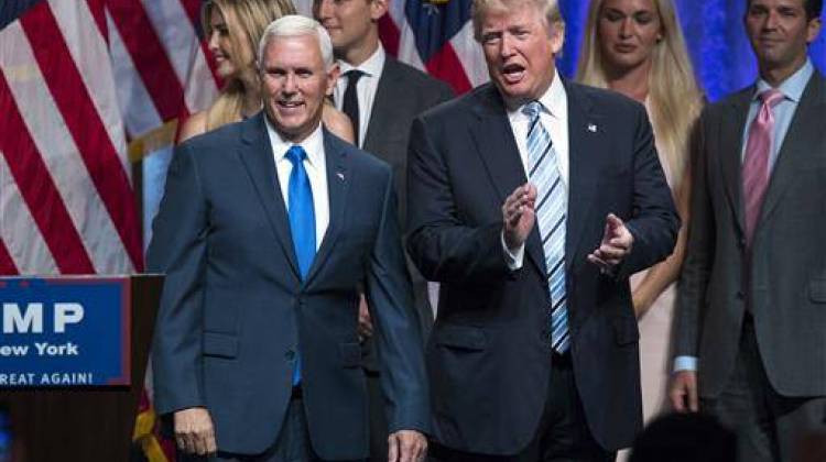 Republican presidential candidate Donald Trump, right, introduces Gov. Mike Pence, R-Ind., during a campaign event to announce Pence as the vice presidential running mate on, Saturday, July 16, 2016 - AP Photo/Evan Vucci