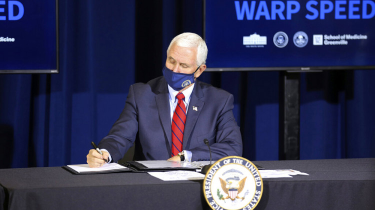Vice President Mike Pence takes notes during a discussion about upcoming COVID-19 vaccines at the University of South Carolina School of Medicine in Greenville, S.C., on Thursday, Dec. 10, 2020. Pence asked Americans to be patient as the vaccine rolls out.  - AP Photo/Jeffrey Collins