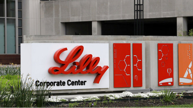 FILE - This April 26, 2017 file photo shows the Eli Lilly & Co. corporate headquarters in Indianapolis. Shares of Eli Lilly jumped after the drugmaker laid out a better-than-expected revenue forecast and plans to buy a young company developing a potential Parkinson’s disease treatment. - AP Photo/Darron Cummings