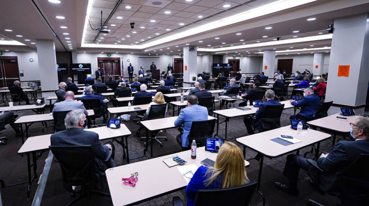 Members of the Indiana House convene in the House chamber in the Indiana Government Center in Indianapolis, Monday, Jan. 4, 2021. The House is meeting in a conference room in the state office building to increase social distancing due to COVID-19. - AP Photo/Michael Conroy