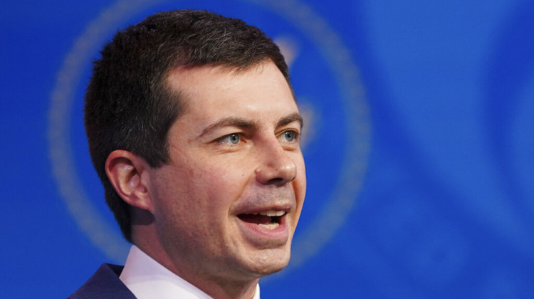 FILE - In this Dec. 16, 2020, file photo President-elect Joe Biden's nominee for Transportation Secretary former South Bend, Ind. Mayor Pete Buttigieg, President-elect speaks during a news conference at The Queen theater in Wilmington, Del.  - Kevin Lamarque/Pool via AP, File