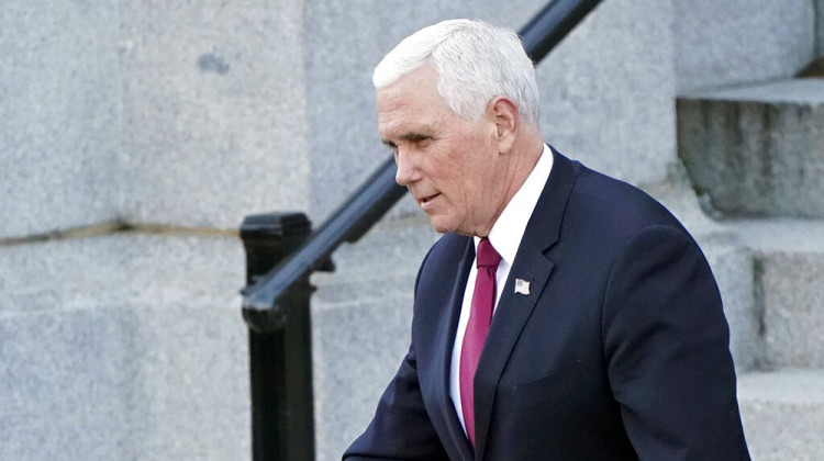 Vice President Mike Pence walks to the West Wing of the White House after addressing staff on the steps of the Eisenhower Executive Office Building, in the White House complex, Tuesday, Jan. 19, 2021, in Washington.  - AP Photo/Gerald Herbert