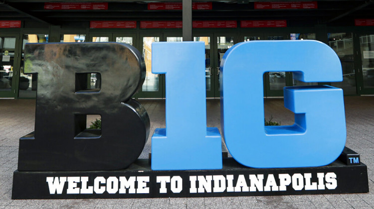 FILE - Big Ten signage is shown outside The Bankers Life Fieldhouse in Indianapolis, in this March 12, 2020, file photo. Big Ten officials have decided to move next month's men's basketball tournament from Chicago to Indianapolis. Games will be played March 10-14 at Lucas Oil Stadium, which also will be the site of this year's Final Four.  - AP Photo/Michael Conroy, File