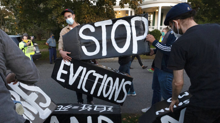 FILE - In this Oct. 14, 2020, file photo, housing activists erect a sign in Swampscott, Mass. A federal freeze on most evictions is set to expire soon. The moratorium, put in place by the Centers for Disease Control and Prevention in September, was the only tool keeping millions of tenants in their homes.  - AP Photo/Michael Dwyer, File