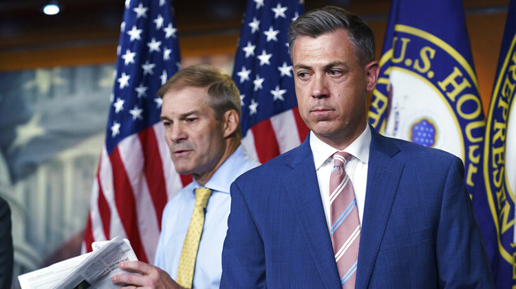 Twitter suspended the account of U.S. Rep. Jim Banks, R-Ind. (right), Saturday after removing a post about a transgender Biden administration official. - AP Photo/J. Scott Applewhite