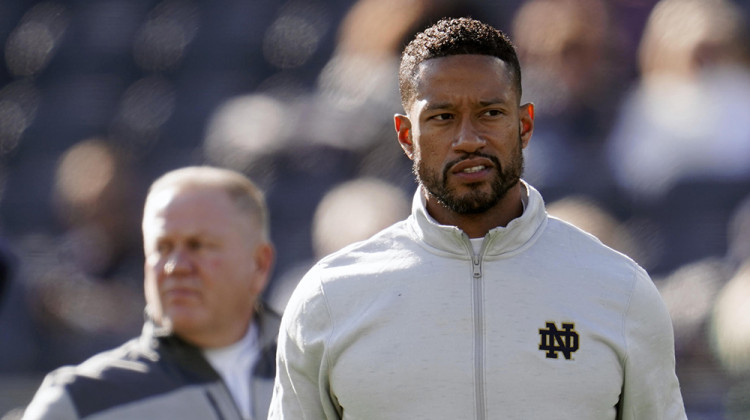 Notre Dame defensive coordinator Marcus Freeman watches during warmups before an NCAA college football game against Navy in South Bend, Ind., Saturday, Nov. 6, 2021.  - AP Photo/Paul Sancya, File