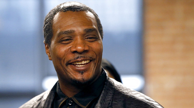 FILE - In this Friday, Feb. 10, 2017, photo, Keith Cooper, 49, smiles during a news conference in Chicago, after Indiana Gov. Eric Holcomb granted him a pardon.  - AP Photo/Charles Rex Arbogast, File