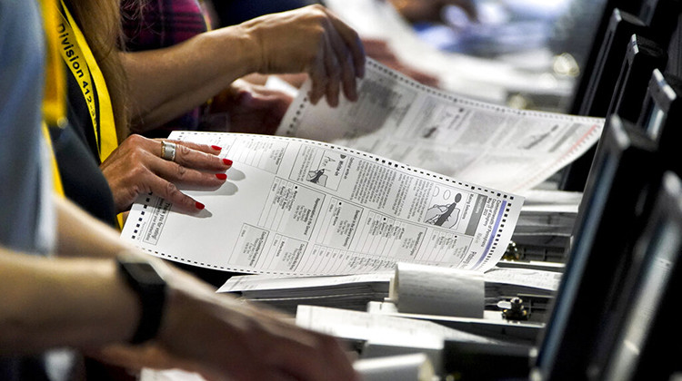 FILE - Election workers perform a recount of ballots from the recent Pennsylvania primary election at the Allegheny County Election Division warehouse on the Northside of Pittsburgh, June 1, 2022.  - AP Photo/Gene J. Puskar, File