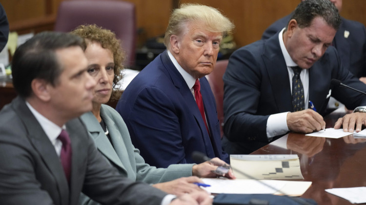 Former President Donald Trump sits at the defense table with his legal team in a Manhattan court, Tuesday, April 4, 2023, in New York. Trump is appearing in court on charges related to falsifying business records in a hush money investigation, the first president ever to be charged with a crime.  - AP Photo/Seth Wenig, Pool