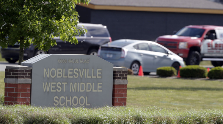 Parents drive students to school as they return to class May 30, 2018, for the first time at Noblesville West Middle School in Noblesville, Ind., since a shooting the previous week. A judge Wednesday, Oct. 4, 2023, approved the release of the teenager who opened fire at the school, wounding another student and a teacher, a prosecutor said. The judge approved the 18-year-old's release from juvenile detention into the custody of his parents because he is now an adult and could no longer be l - AP Photo/Michael Conroy, File