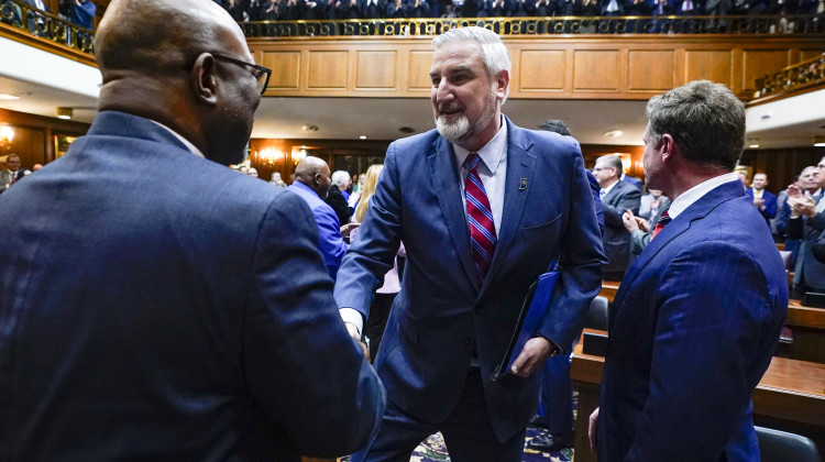Indiana Gov. Eric Holcomb, center, is joined by Speaker of the House Todd Huston, left, and Lt. Gov. Suzanne Crouch as he is introduced before delivering his State of the State address to a joint session of the legislature at the Statehouse, Tuesday, Jan. 9, 2024, in Indianapolis. - AP Photo/Darron Cummings
