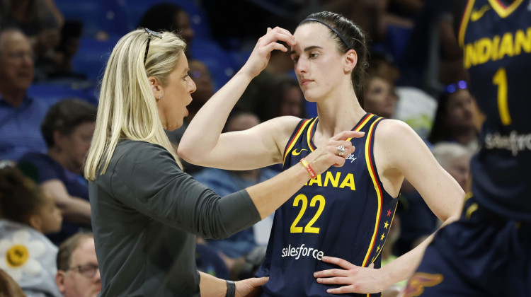 Indiana Fever head coach Christine Sides, left, talks to Fever guard Caitlin Clark (22) as they play the Dallas Wings during the first half of an WNBA basketball game in Arlington, Texas, Friday, May 3, 2024. - Michael Ainsworth / AP Photo