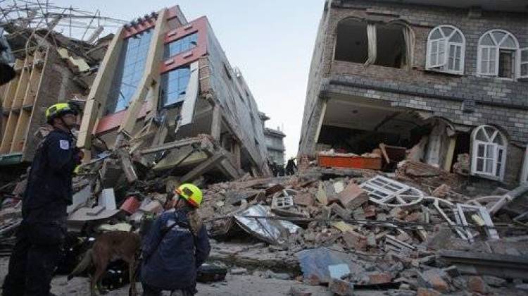 USAID rescue workers inspect the site of collapsed buildings after an earthquake in Kathmandu, Nepal, Tuesday, May 12, 2015.  - The Associated Press