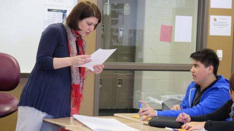 Amy Peddie, seen helping a student with an assignment at Southport High School, helped shape the English language learning program there. “I’d never teach anything else now,†said Peddie, 39. “I love it.†- Shaina Cavazos/Chalkbeat Indiana