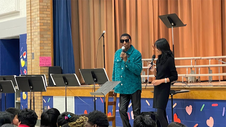 Grammy award winner Kenneth Edmonds, best known by his stage name Babyface, speaks to an auditorium of hundreds of students at Carl Wilde School 79 on the west side of Indianapolis on Thursday, Feb. 15, 2023. - Sydney Dauphinais/WFYI