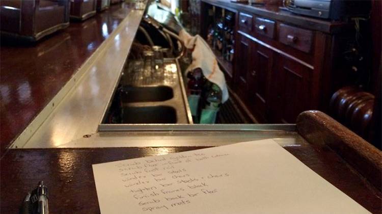 A list of cleaning tasks sits on the bar of the Knickerbocker Saloon. - Sarah Fentem