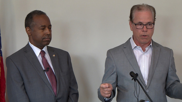 HUD Secretary Ben Carson, left, and Sen. Mike Braun (R-Ind.) discuss opportunity zones in Indianapolis. - WTIU