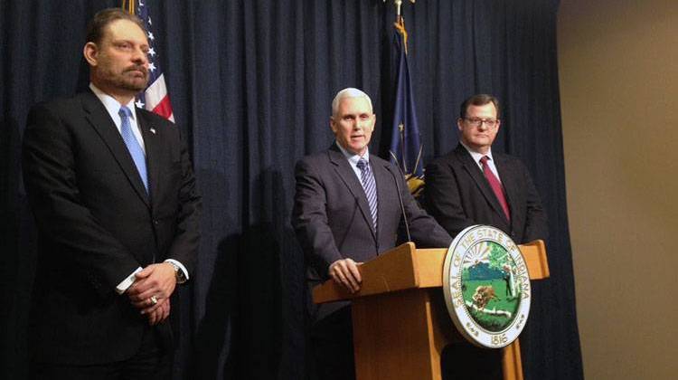From left: Kent Abernathy, current chief of staff for IDEM and the to-be new BMV commissioner, Gov. Pence, and Don Snemis, the current BMV commissioner. - Gretchen Frazee