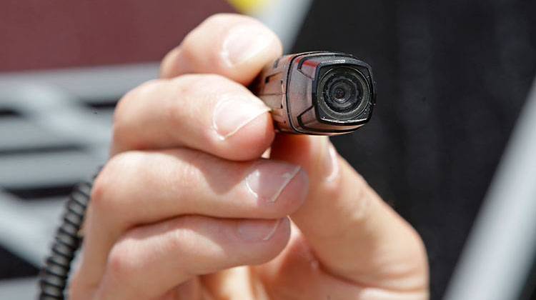 Indiana law doesnâ€™t provide specific direction as to whether footage from police body cameras, like this one, should be available to the public.   - AP photo