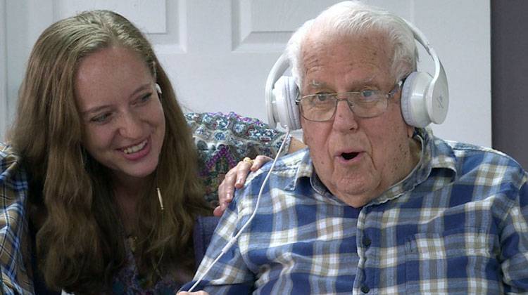 Jennie Gubner and Bruce Nelson sing along to Louis Armstrong during a Music and Memory listening session at Better Day Club in Bloomington. - Barbara Brosher/IPB