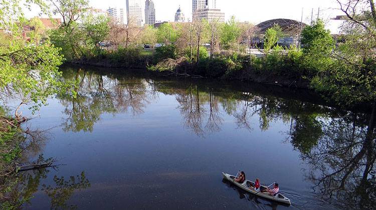 A family canoes down the St. Mary's River near downtown Fort Wayne. City officials are seeking designs for a downtown riverfront promenade. - Photo by Momoneymoproblemz, CC-BY-SA-3.0
