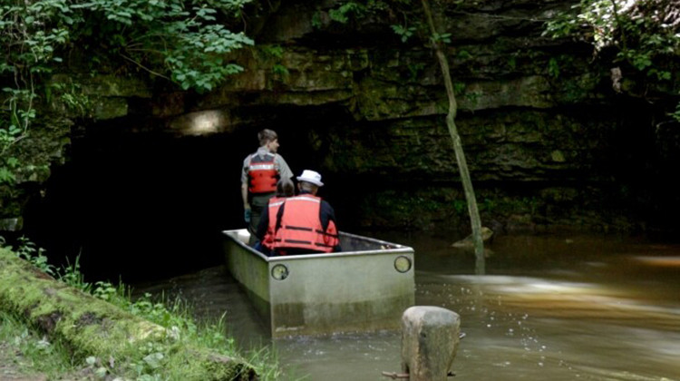 Indiana Department of Natural Resources guide Andrew Norrington takes a group into the Twin Caves Boat Tour at Spring Mill State Park on June 4, 2022. - Tim Jagielo/WNIN