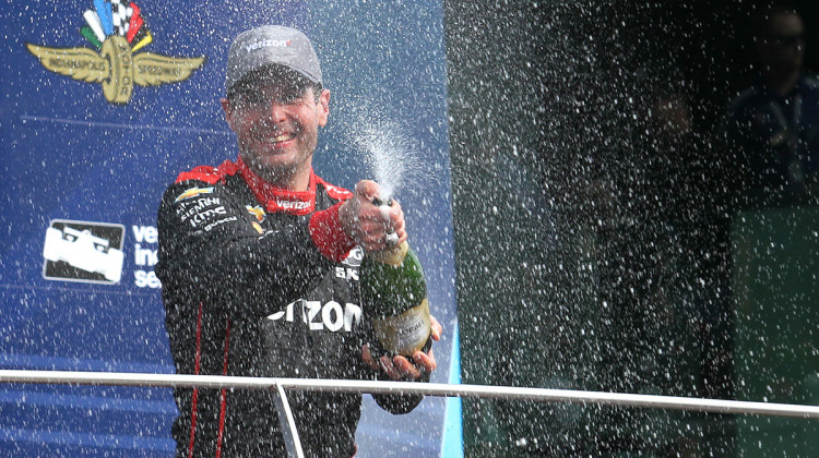 Will Power celebrates with champagne in victory lane after winning the IndyCar Grand Prix on Saturday, May 12 ,2018. - Doug Jaggers/WFYI