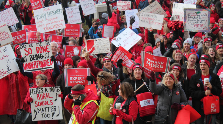 Teachers from across Indiana wave signs and chant before rallying both inside and outside of the Indiana Statehouse.  - Lauren Chapman/IPB News