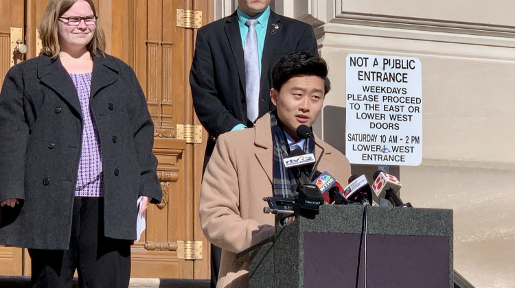 Megan Stoner, left, and Rep. Chris Chyung (D-Dyer), at lectern, support lowering the age limits to serve in the Indiana General Assembly.  - Brandon Smith/IPB News